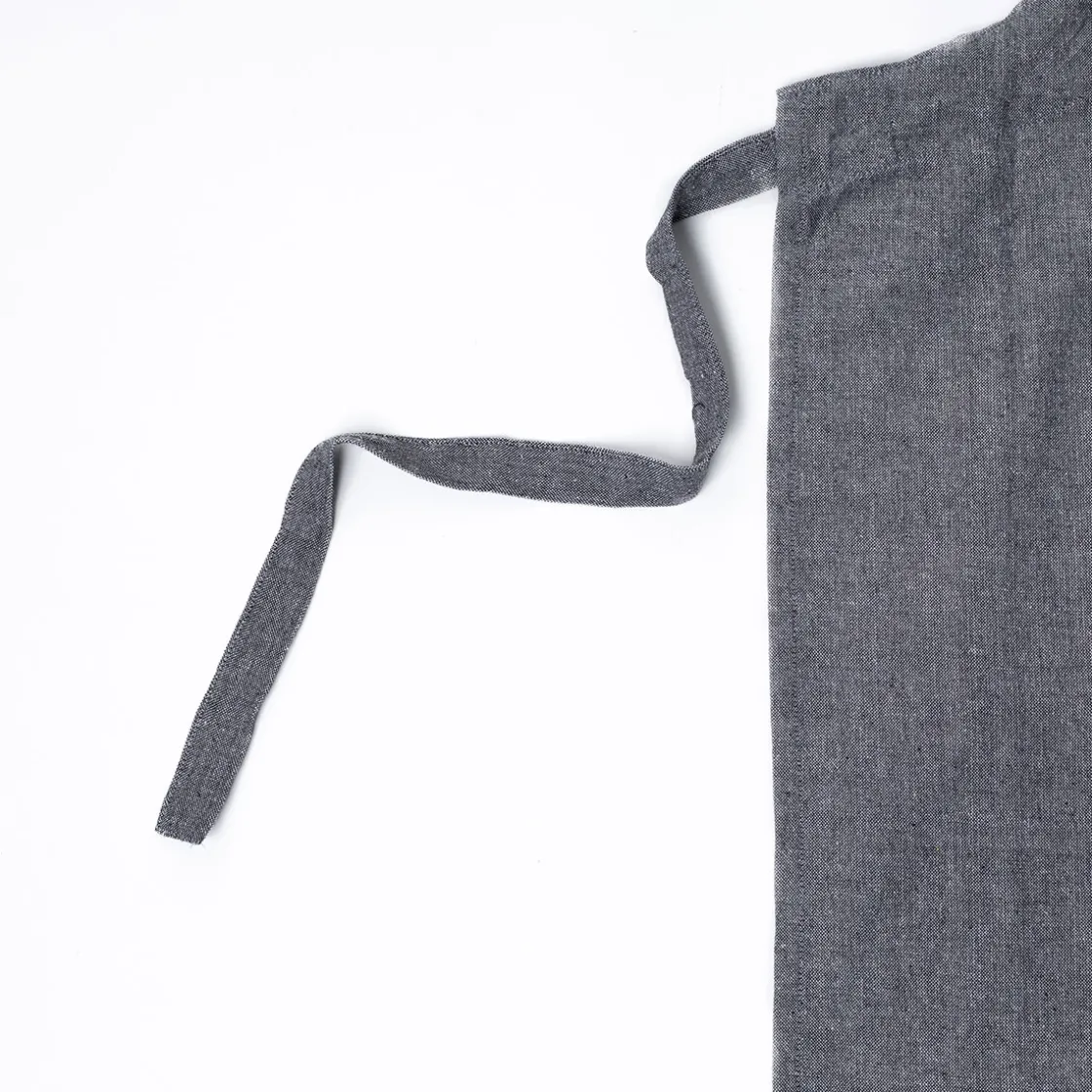 Delantales, Asas Y Paños>Delantal de cocina con frase gris oscuro 60x80cm