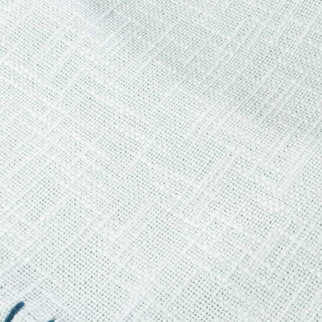 atmosphera Téxtil>Manta crudo con borlas azules 120x160cm